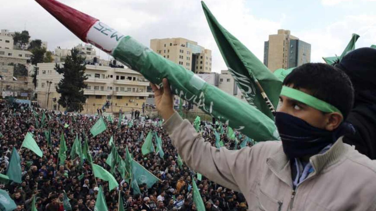 Palestinian youth holds model of Hamas-made rocket during rally in West Bank city of Hebron A Palestinian youth holds a model of a Hamas-made rocket during a rally in the West Bank city of Hebron, marking the 25th anniversary of the founding of Hamas, December 14, 2012. It was one of the first rallies Western-backed Palestinian President Mahmoud Abbas allowed to take place in the West Bank since 2007, when his Islamist rivals Hamas seized control of the Gaza Strip. REUTERS/Ammar Awad (WEST BANK - Tags: ANNIVERSARY CIVIL UNREST POLITICS) - RTR3BKFO