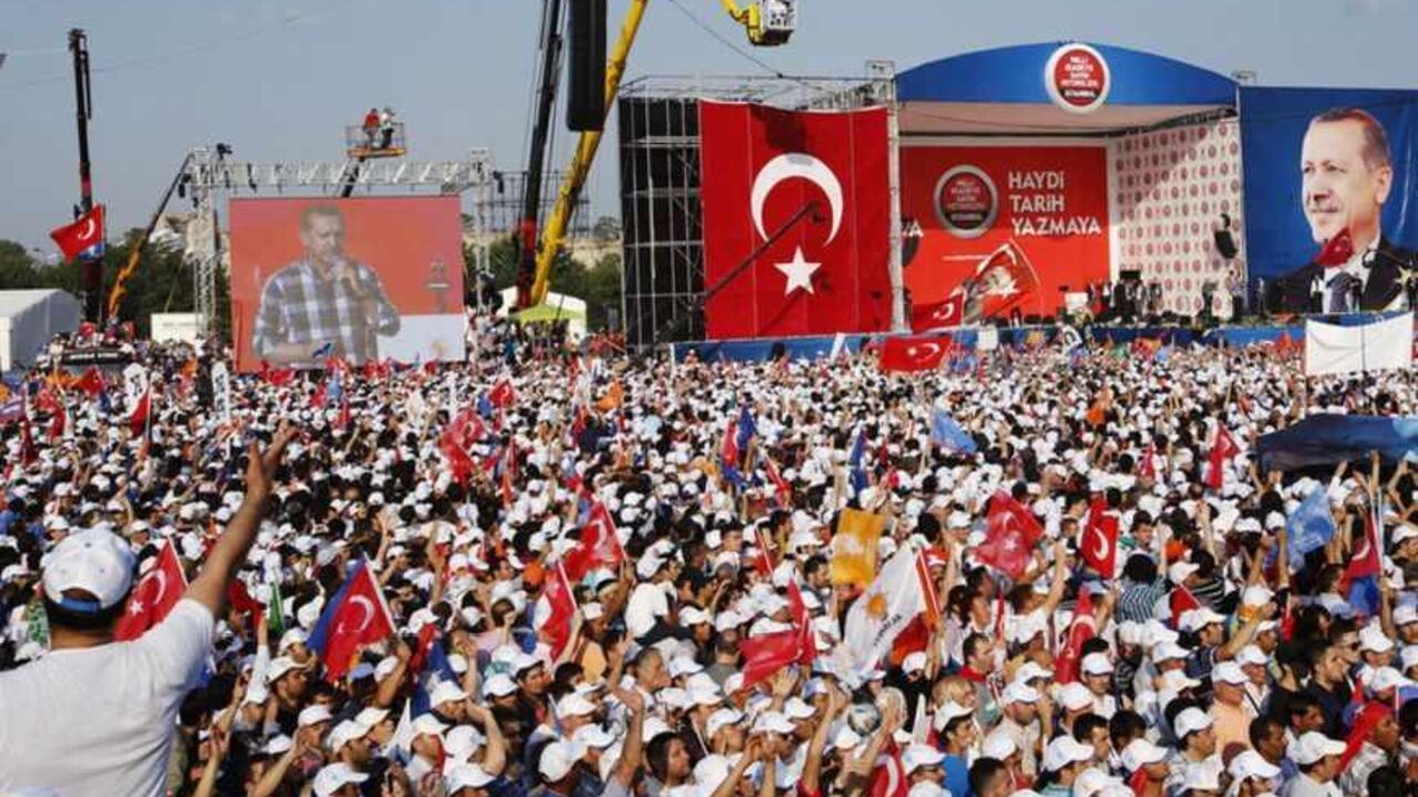 Turkish PM Erdogan addresses his supporters during a rally by his ruling AK Party in Istanbul Turkish Prime Minister Tayyip Erdogan addresses his supporters during a rally by his ruling AK Party in Istanbul June 16, 2013. Erdogan rallied hundreds of thousands of supporters at an Istanbul parade ground on Sunday as riot police fired teargas several kilometres away in the city centre to disperse anti-government protesters. REUTERS/Murad Sezer (TURKEY - Tags: POLITICS CIVIL UNREST) - RTX10PZS