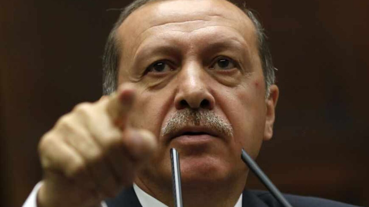 Turkey's Prime Minister Tayyip Erdogan addresses members of parliament from his ruling AK Party during a meeting at the Turkish parliament in Ankara Turkey's Prime Minister Tayyip Erdogan addresses members of parliament from his ruling AK Party (AKP) during a meeting at the Turkish parliament in Ankara June 25, 2013. Turkish anti-terrorism police detained 20 people in raids in the capital Ankara on Tuesday in connection with weeks of anti-government protests across the country, media reports said. The unrest began at the end of May when police used force against campaigners opposed to plans to redevelop a central Istanbul park. The protest spiralled int