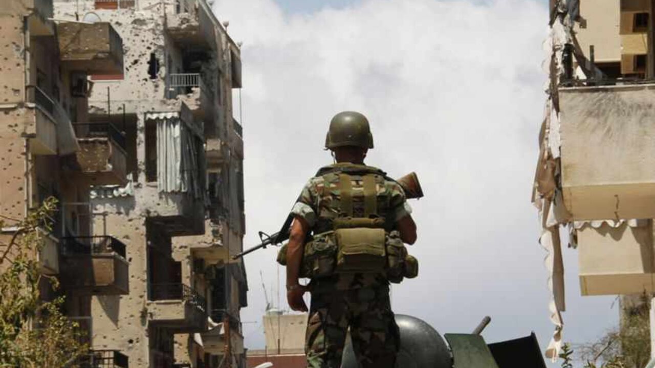 A Lebanese army soldier stands atop of an APC as he patrols the area near the mosque complex where hardline Sunni cleric Sheikh Ahmed al-Assir was believed to be sheltering with his supporters, in Abra near Sidon A Lebanese army soldier stands atop of an armoured personnel carrier (APC) as he patrols the area near the mosque complex where hardline Sunni cleric Sheikh Ahmed al-Assir was believed to be sheltering with his supporters, in Abra near Sidon, southern Lebanon June 25, 2013. The Lebanese government will try on Tuesday to secure the country after the deadliest violence since the start of a two-year conflict in neighbouring Syria that has pushed Lebanon's myriad militia to clashes. Gunfights between the army a