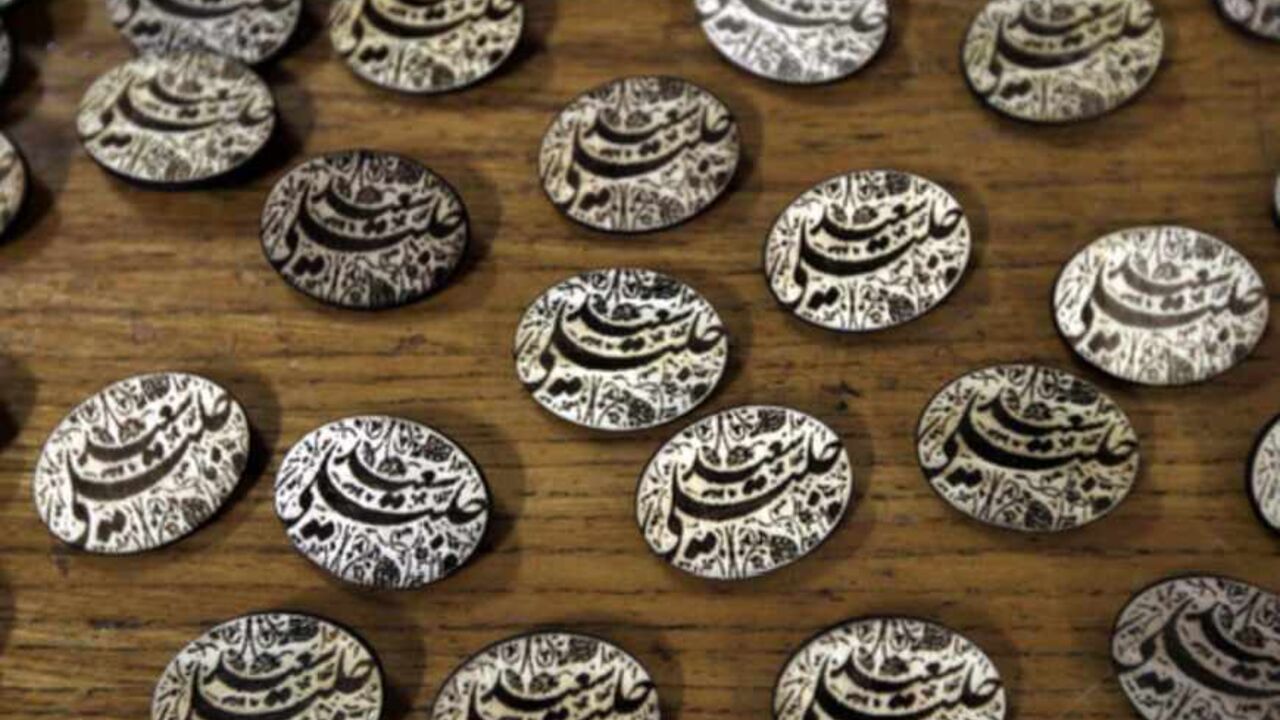 IRAN-POLITICS-VOTE-JALILI Campaign pins of Iranian presidential candidate and lead nuclear negotiator Saeed Jalili are displayed for sale at Tehran University in the Iranian capital on June 3, 2013. The eight candidates standing for president this month may differ on several issues, but when it comes to Iran's nuclear drive they are united in pursuing what they see as its peaceful atomic ambitions. AFP PHOTO/ATTA KENARE (Photo credit should read ATTA KENARE/AFP/Getty Images)