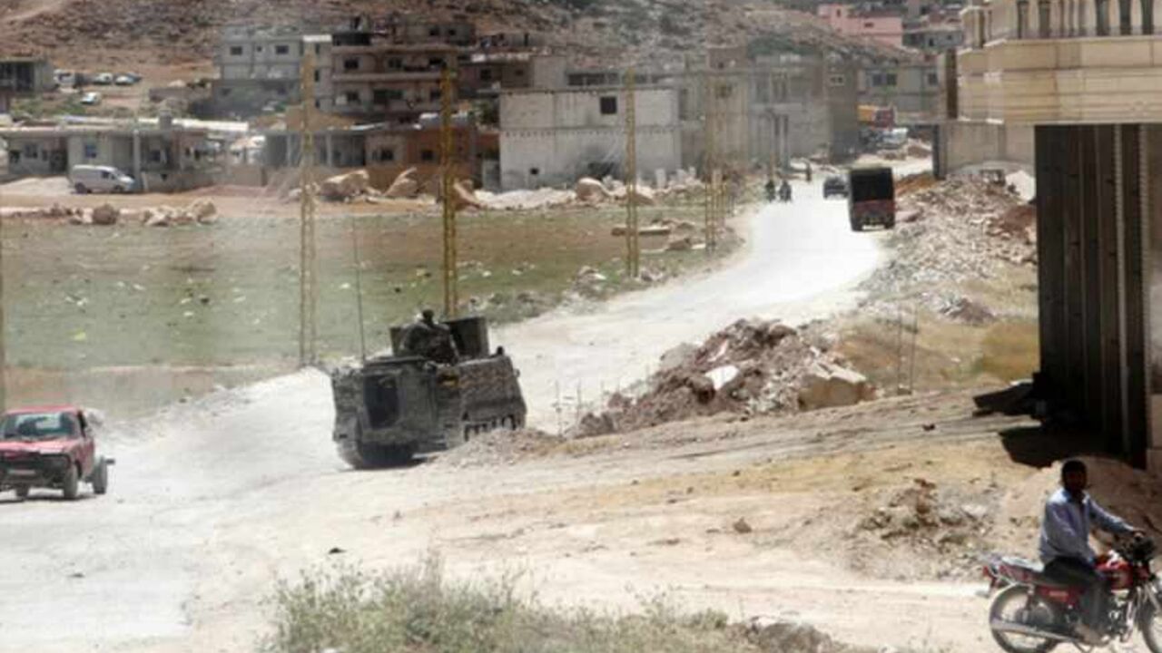 Lebanese Army soldiers patrol town of Arsal after being deployed to tighten security after two men died in clashes near a Lebanese army checkpoint June 6, 2013. Two men died in clashes near a Lebanese army checkpoint on Thursday, a security source said, in a possible spillover from the recent fighting in the nearby Syrian border town of Qusair.  REUTERS/Ahmad Shalha (LEBANON - Tags: CIVIL UNREST MILITARY POLITICS) - RTX10DYD