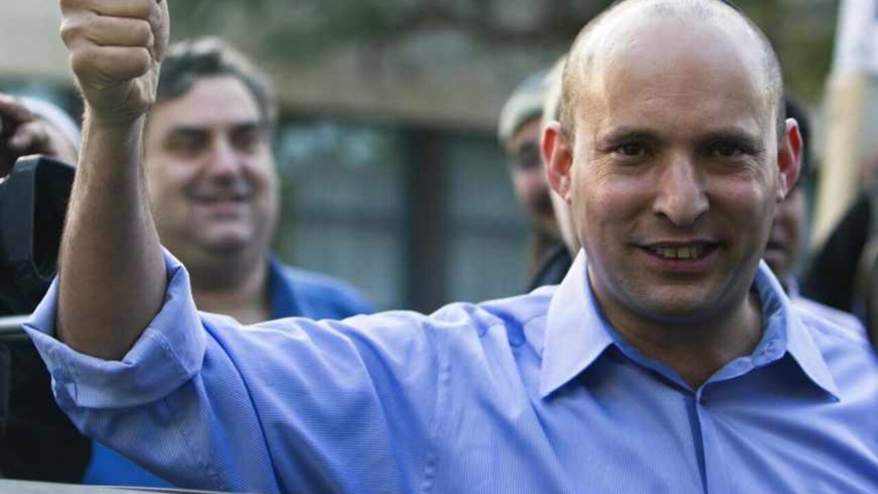 Naftali Bennett, leader of the Bayit Yehudi party, gestures after casting his vote for the parliamentary election at a polling station in Raanana, near Tel Aviv January 22, 2013. Israelis voted on Tuesday in an election widely expected to win Prime Minister Benjamin Netanyahu a third term in office, pushing the Jewish State further to the right, away from peace with Palestinians and towards a showdown with Iran. REUTERS/Nir Elias (ISRAEL - Tags: POLITICS ELECTIONS) - RTR3CS5X