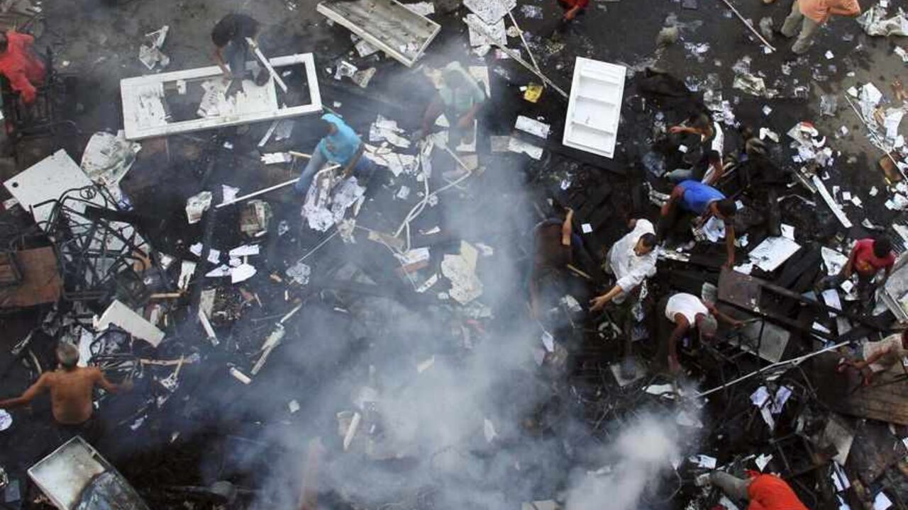 EGYPT-PROTESTS/ A scene of the aftermath of a fire that was set in the headquarters of the Freedom and Justice Party by anti-Mursi protesters during clashes between them and supporters of Egyptian president Mohamed Mursi in Sedy Gaber in Alexandria, June 28, 2013. Egypt's leading religious authority warned of "civil war" on Friday and called for calm after a member of the ruling Muslim Brotherhood was killed ahead of mass rallies aimed at forcing the president to quit. Picture taken June 28, 2013. REUTERS/Stringer (EGYPT -
