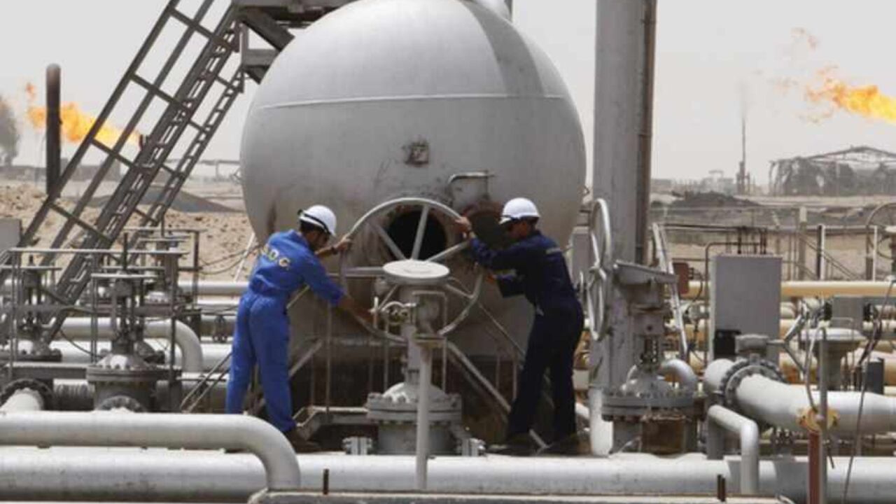 File photo of workers of SOC adjusting a valve at the Rumaila oil field in Basra Province Workers of South Oil Company (SOC) adjust a valve at the Rumaila oil field in Basra Province in this May 24, 2010 file photo. The initial development plan agreed by Exxon Mobil and its partners for Iraq's West Qurna Phase One oilfield included drilling eight new wells and overhauling up to 50 wells this year to boost output. Exxon Mobil wants to leave its flagship Iraqi oil project after upsetting Baghdad by signing a deal last year with the autonomous northern Kurdish region, which the central government d