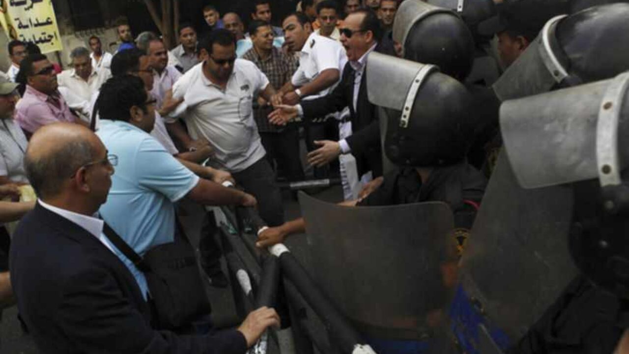 Egypt's opposition members shouts slogans against against Egyptian President Mohamed Mursi and members of the Muslim Brotherhood as they clash with riot police during a protest against the new judicial law in front of Egypt's Shura Council in Cairo Egypt's opposition members shouts slogans against against Egyptian President Mohamed Mursi and members of the Muslim Brotherhood as they clash with riot police during a protest against the new judicial law in front of Egypt's Shura Council in Cairo May 25, 2013. Egypt's highest court ruled on Saturday that parts of a revised election law setting out terms for a parliamentary election were unconstitutional, casting fresh doubt over a poll that has already been delayed. The Shura Council has approved, Saturda