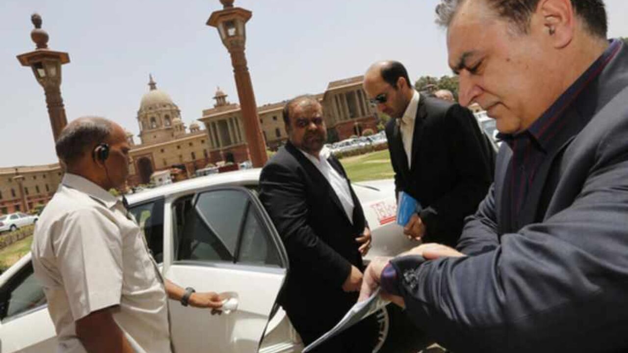 Iran's Oil Minister Rostam Qasemi arrives to attend a meeting with India's Finance Minister Palaniappan Chidambaram in New Delhi Iran's Oil Minister Rostam Qasemi (C) arrives to attend a meeting with India's Finance Minister Palaniappan Chidambaram (not seen) in New Delhi May 28, 2013. Iran has offered insurance to Indian refiners in a bid to boost its crude sales, industry sources said, though some oil executives warned the plan would not remove the threat of western sanctions. The offer was made during a visit to India led by Qasemi in a bid to revive crude sales from its second-largest customer. REUTERS/Adnan Abidi (INDIA - Tags: