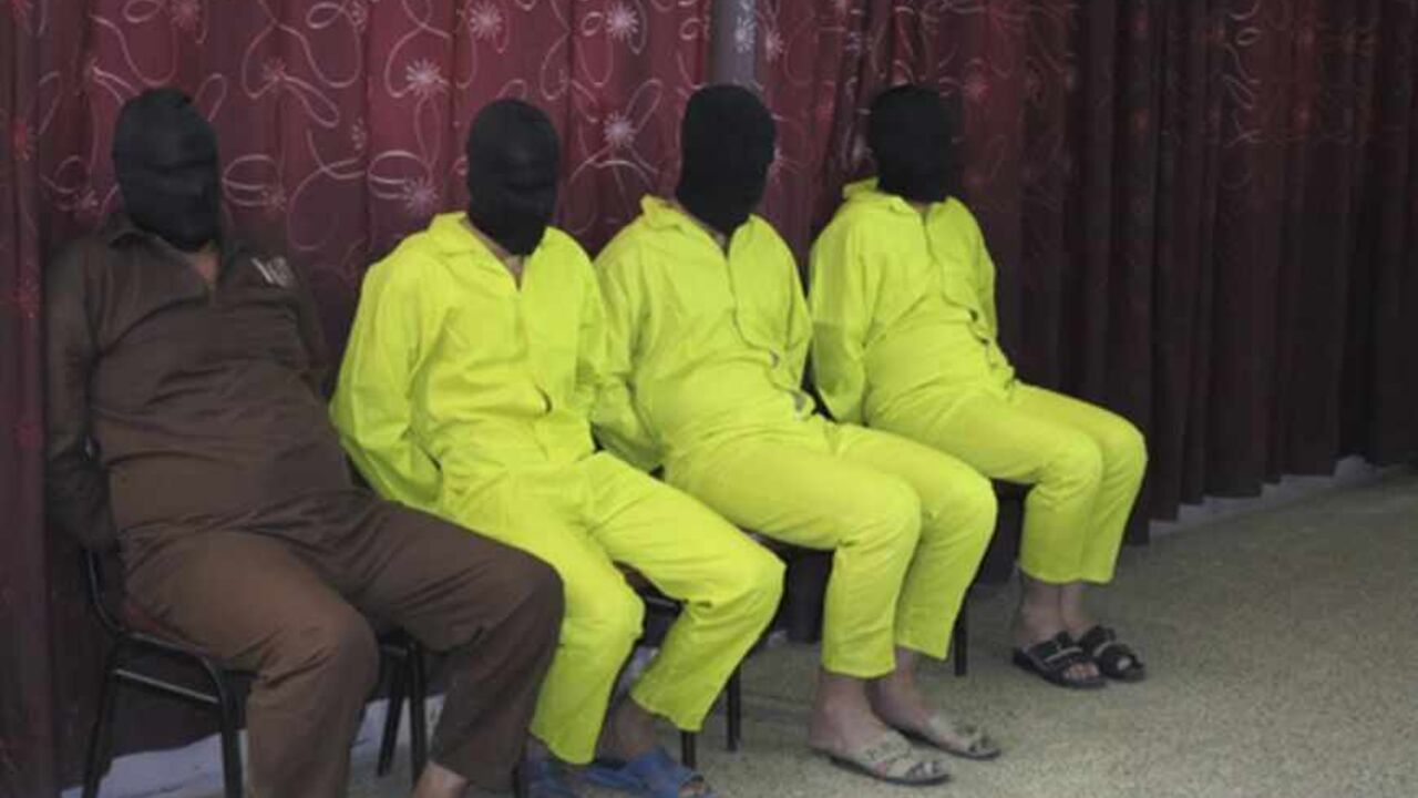 Detainees suspected of being part of an armed cell with links to al Qaeda are shown to the media during a news conference in Baghdad Detainees suspected of being part of an armed cell with links to al Qaeda are shown to the media during a news conference at the Defence Ministry in Baghdad June 1, 2013. The four men are accused of planning to make chemical weapons like nerve and mustard gas, according to the ministry. REUTERS/Stringer (IRAQ - Tags: CIVIL UNREST CRIME LAW POLITICS) - RTX10827