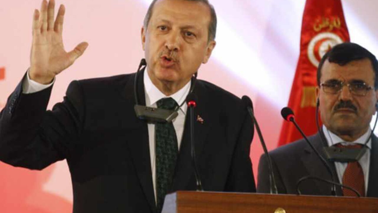 Recep Tayyip Erdogan speaks next to Ali Larayedh during a news conference in Tunis Turkish Prime Minister Recep Tayyip Erdogan (L) speaks next to his Tunisian counterpart Ali Larayedh during a news conference in Tunis June 6, 2013. REUTERS/Zoubeir Souissi (TUNISIA - Tags: POLITICS) - RTX10DY9