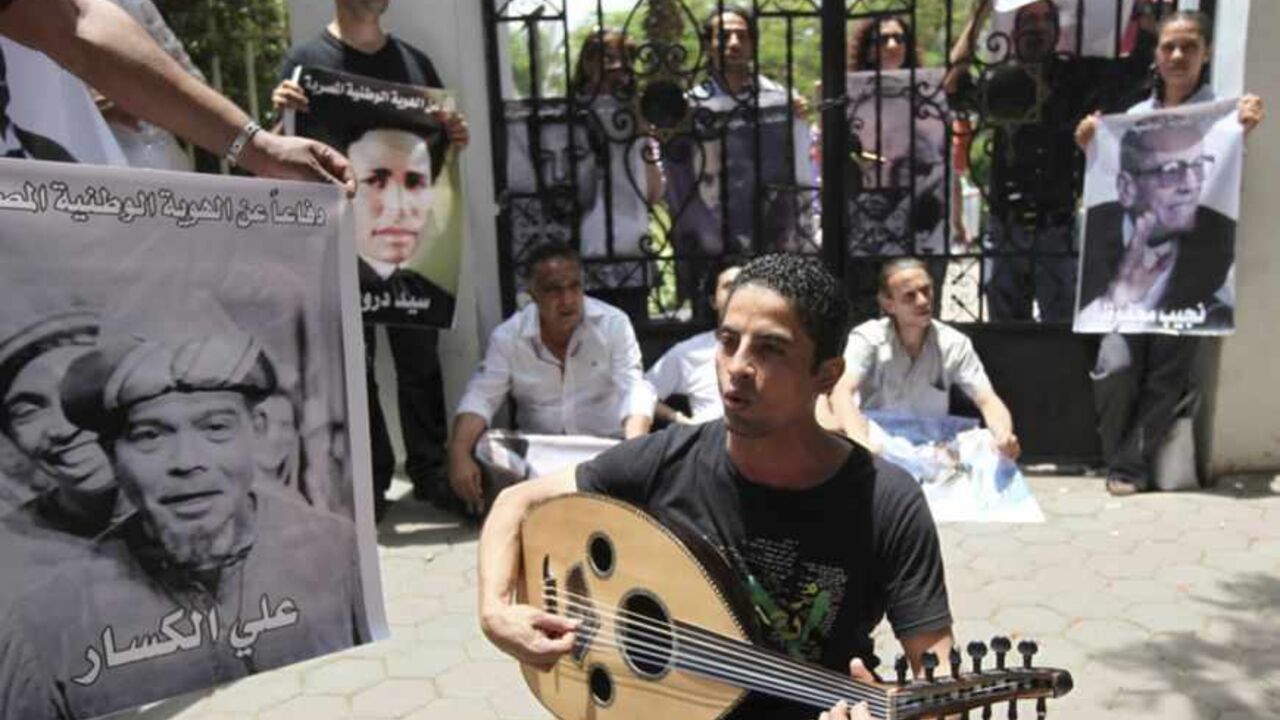 Intellectuals and artists carry pictures of some of the popular Egyptian artists and writers as they demonstrate in front of the Ministry of Culture in Cairo Intellectuals and artists, who are anti-Mursi protestors, carry pictures of some of the popular Egyptian artists and writers as they demonstrate in front of the Ministry of Culture against what they claimed are increasing influence of the Muslim Brotherhood over the Ministry of Culture, in Cairo June 9, 2013. Egyptian President Mohamed Mursi increased the influence of his Muslim Brotherhood over government in a cabinet reshuffle in May that replaced two ministers involved in crucial talks with the IMF over