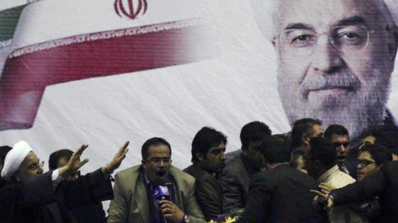 Iranian presidential candidate Rohani waves to supporters in the central Iranian city of Shiraz Iranian presidential candidate Hassan Rohani (L) waves to supporters in the central Iranian city of Shiraz June 11, 2013. Picture taken June 11, 2013. REUTERS/Fars News/Mohammad Hadi Khosravi (IRAN - Tags: POLITICS ELECTIONS) ATTENTION EDITORS - THIS IMAGE WAS PROVIDED BY A THIRD PARTY. FOR EDITORIAL USE ONLY. NOT FOR SALE FOR MARKETING OR ADVERTISING CAMPAIGNS. THIS PICTURE WAS PROCESSED BY REUTERS TO ENHANCE QUALITY. AN UNPROCESSED VERSION WILL BE PROVIDED SEPARATELY - RTX10L2E