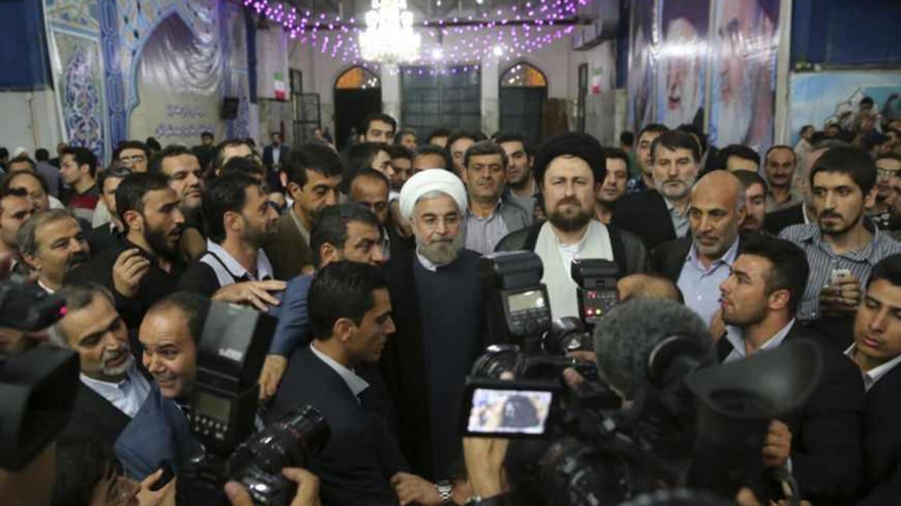 Iranian President-elect Hassan Rohani speaks to the media following a visit to the Khomeini mausoleum in Tehran Iranian President-elect Hassan Rohani (C) speaks to the media following a visit to the Khomeini mausoleum in Tehran June 16, 2013. Reuters/Fars News/Seyed Hassan Mousavi (IRAN - Tags: POLITICS) ATTENTION EDITORS - THIS IMAGE WAS PROVIDED BY A THIRD PARTY. FOR EDITORIAL USE ONLY. NOT FOR SALE FOR MARKETING OR ADVERTISING CAMPAIGNS. THIS PICTURE IS DISTRIBUTED EXACTLY AS RECEIVED BY REUTERS, AS A SERVICE TO CLIENTS - RTX10Q47