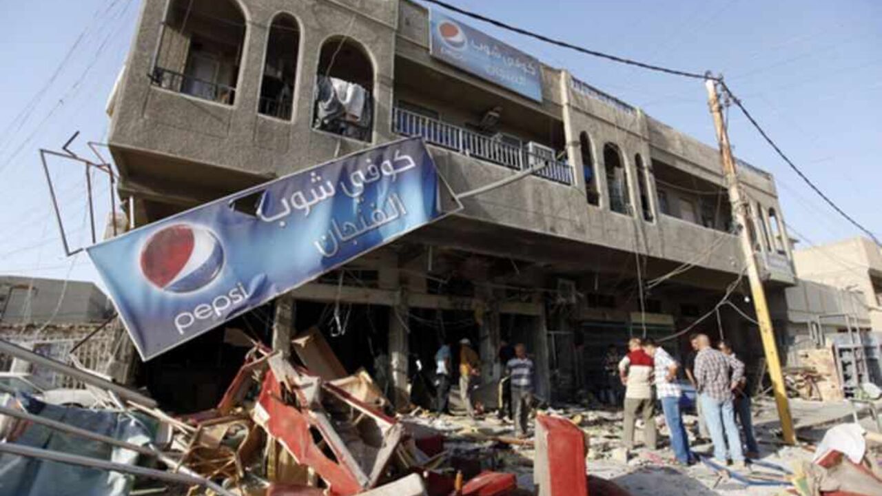 Residents gather at the premises of a coffee shop that was destroyed in a suicide bomb attack the night before, in Baghdad Residents gather at the premises of a coffee shop that was destroyed in a suicide bomb attack the night before, in Baghdad June 17, 2013. Five people were killed and 20 were wounded in the attack, police said. REUTERS/Saad Shalash (IRAQ - Tags: CIVIL UNREST TPX IMAGES OF THE DAY) - RTX10QGM