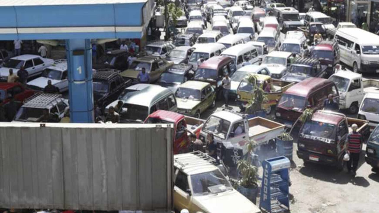 Vehicles queue at a petrol station at a gas and a petrol station during a fuel shortage at the country in Cairo Vehicles queue at a petrol station during a fuel shortage in Cairo June 26, 2013. President Mohamed Mursi will speak to the Egyptian people on Wednesday in a televised address that could determine his political survival as millions prepare to rally to demand his removal this weekend. Fears of a showdown in the streets between Mursi's Islamist supporters and a broad coalition of the disaffected have led people to stock up on food and buy up fuel supplies. REUTERS/Mohamed Abd El Ghany (EGYPT - Tags: POLITIC
