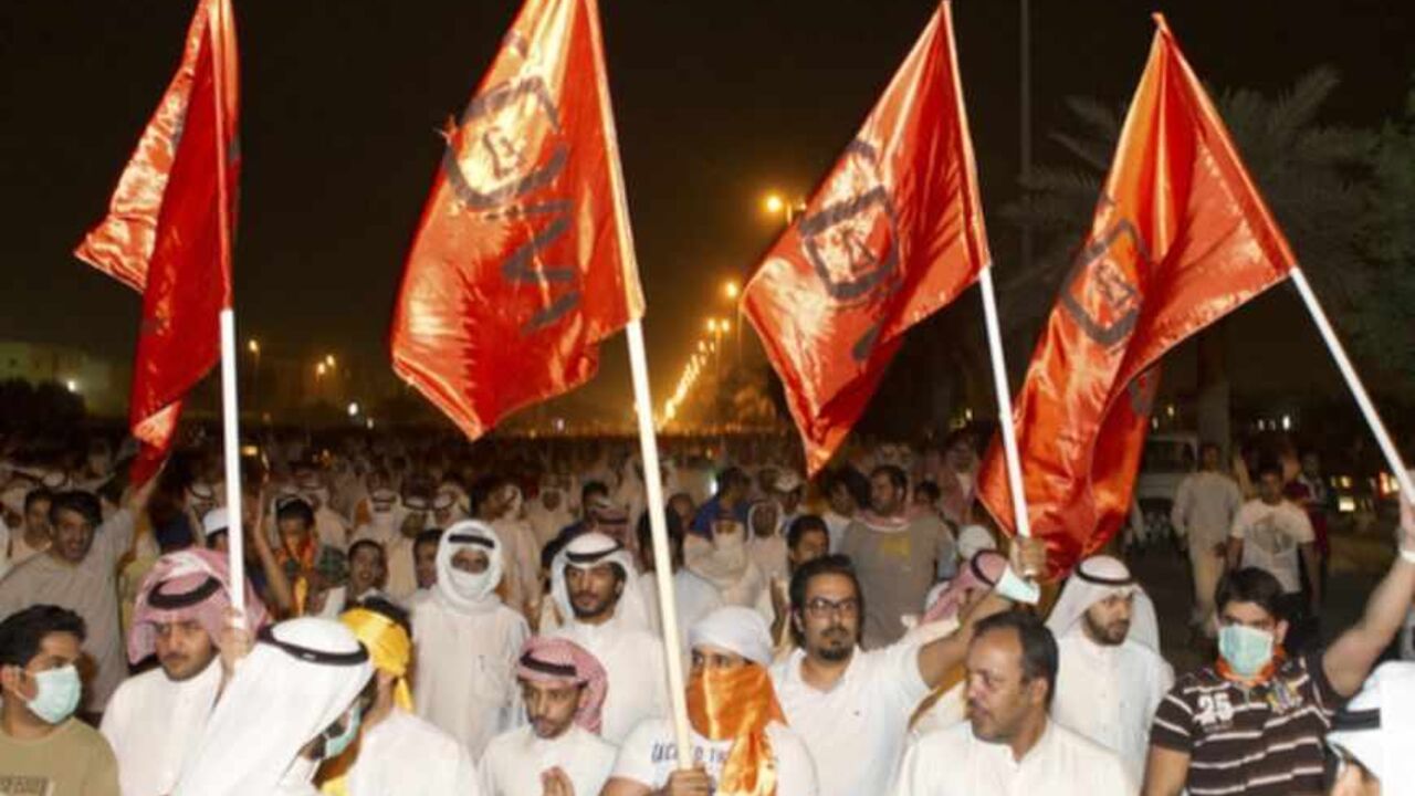 Supporters of Kuwaiti former member of parliament and opposition politician Barrak wave flags as they march towards the central prison in Andulos, after a ruling sentenced Barrak to jail for insulting the emir Supporters of Kuwaiti former member of parliament and opposition politician Musallam al-Barrak wave flags as they march towards the central prison in Andulos, after a ruling sentenced Barrak to jail for insulting the emir, April 15, 2013. Barrak was sentenced to five years in jail on Monday for insulting the emir, his lawyer said, in a ruling that brought thousands of people to the streets in protest. The Kuwaiti criminal court found Barrak guilty of insulting Sheikh Sabah al-Ahmad al-Sabah in a speech in O