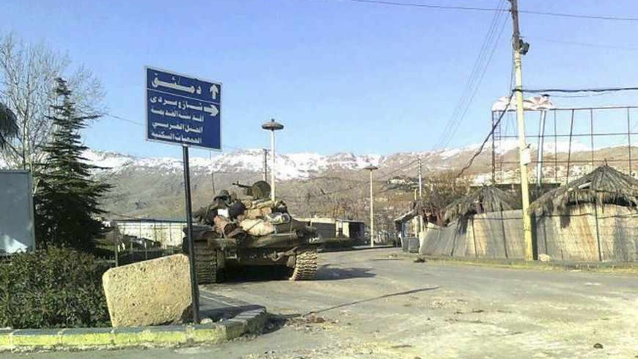 SYRIA A tank is seen in a neighbourhood of Zabadani, near Damascus, February 14, 2012. Syrian government forces launched an offensive on the city of Hama early on Wednesday, firing on residential neighbourhoods from armoured vehicles and mobile anti-aircraft guns, opposition activists said. REUTERS/Handout (SYRIA - Tags: CIVIL UNREST POLITICS MILITARY) FOR EDITORIAL USE ONLY. NOT FOR SALE FOR MARKETING OR ADVERTISING CAMPAIGNS. THIS IMAGE HAS BEEN SUPPLIED BY A THIRD PARTY. IT IS DISTRIBUTED, EXACTLY AS RECEIVE