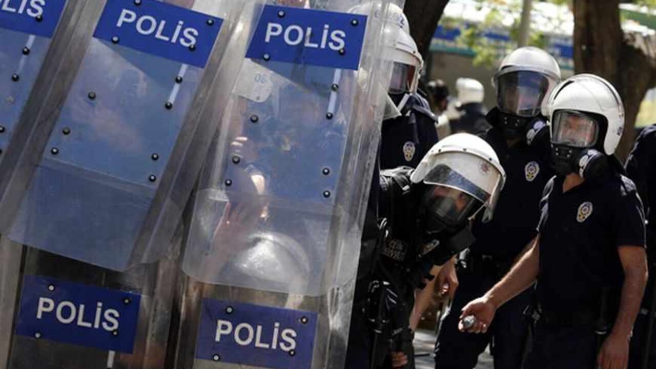 TURKEY-PROTESTS/ Riot police hide behind their shields during clashes with demonstrators during a protest against Turkey's Prime Minister Tayyip Erdogan and his ruling Justice and Development Party (AKP) in central Ankara June 1, 2013. Erdogan made a defiant call for an end to the fiercest anti-government demonstrations in years on Saturday, as thousands of protesters clashed with riot police in Istanbul and Ankara for a second day. REUTERS/Umit Bektas (TURKEY - Tags: POLITICS CIVIL UNREST) - RTX1088W