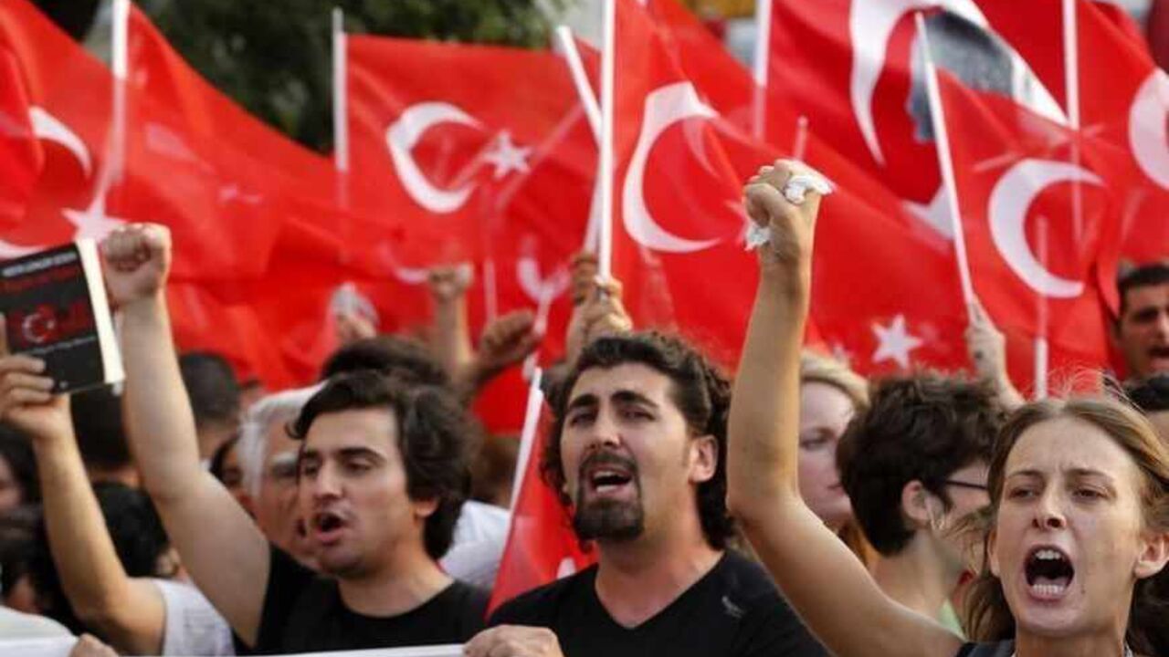 Protesters shout slogans during an anti-government protest at Taksim Square in Istanbul Protesters shout slogans during an anti-government protest at Taksim Square in Istanbul June 29, 2013. Thousands of protesters marched to Istanbul's Taksim Square on Saturday chanting slogans against the government and police after security forces killed a Kurdish demonstrator in southeastern Turkey. The protest had been planned as part of larger unrelated anti-government demonstrations that have swept through the country since the end of May, but became a voice of solidarity with the Kurds after Friday's k