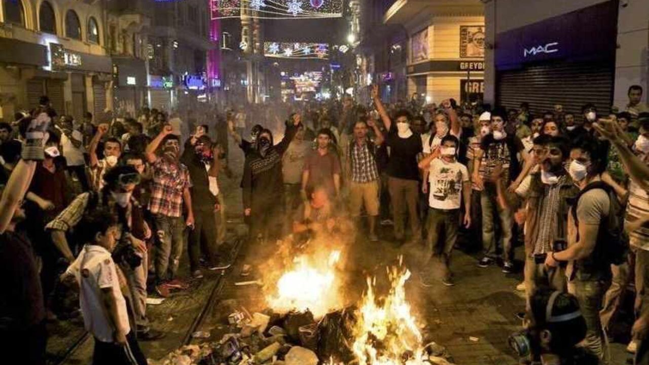 Protesters shout slogans as they block the main Istiklal street in central Istanbul Protesters shout slogans as they block the main Istiklal street in central Istanbul late July 8, 2013. Turkish police fired teargas and water cannon on Monday at protesters who tried to defy a closure order and enter an Istanbul park at the centre of protests against Prime Minister Tayyip Erdogan's government. Gezi Park was only open for a few hours after Istanbul's governor allowed people back in, following often violent protests last month against plans to redevelop the area, when riot police ordered it s