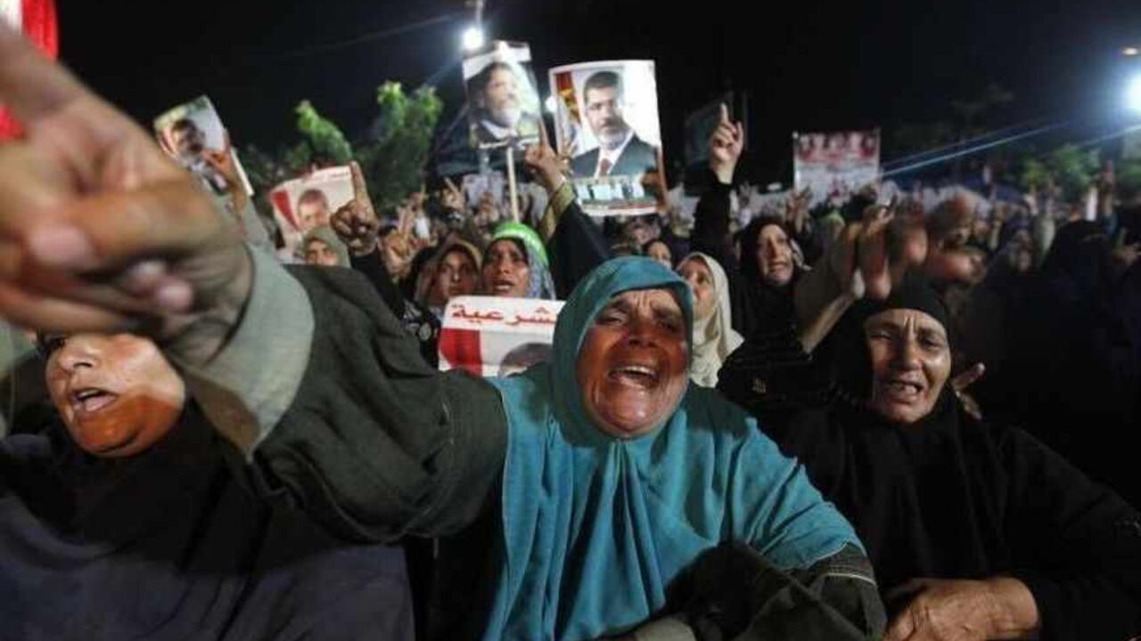 Supporters of deposed Egyptian President Mohamed Mursi shout slogans during a protest at the Rabaa Adawiya square, where they are camping, in Cairo July 27, 2013. At least 70 people died on Saturday after security forces attacked supporters of deposed President Mohamed Mursi in Cairo, Muslim Brotherhood spokesman Gehad El-Haddad said, adding the toll could be much higher. REUTERS/Mohamed Abd El Ghany (EGYPT - Tags: POLITICS CIVIL UNREST) - RTX121Z8