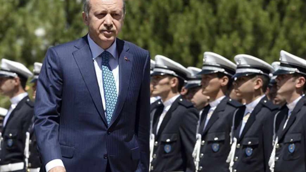 TURKEY Turkey's Prime Minister Tayyip Erdogan reviews students of the Police Academy upon his arrival to their graduation ceremony in Ankara June 24, 2013. REUTERS/Stringer (TURKEY - Tags: POLITICS CRIME LAW) - RTX10YXL