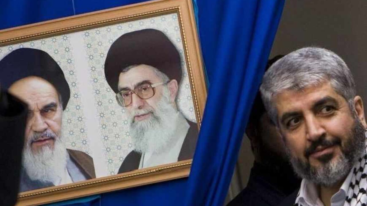 Hamas leader Khaled Meshaal attends a rally in Tehran university Hamas leader Khaled Meshaal (R) attends a rally in Tehran university February 2, 2009. A delegation from Hamas, headed by its leader Meshaal, arrived in Tehran on Sunday as part of a regional push to reinforce support for the Palestinian group after the Israeli invasion of Gaza. The portraits on the left are that of Late Leader Ayatollah Rouollah Khomeini (L) and Iran's Supreme Leader Ayatollah Ali Khamenei. REUTERS/Raheb Homavandi (IRAN) - RTXB5LP