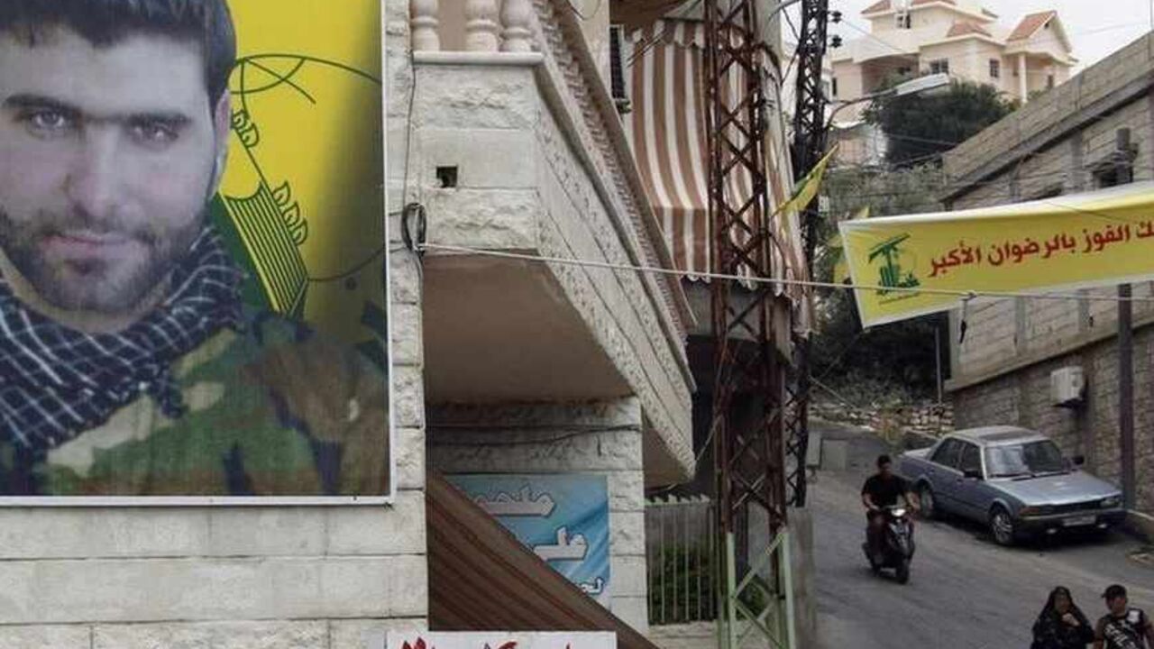 A poster of Mohamed Hassan Shehade, a Hezbollah fighter who died in the Syrian conflict, hangs on a building in Adloun town, south of Sidon A poster of Mohamed Hassan Shehade, a Hezbollah fighter who died in the Syrian conflict, hangs on a building in Adloun town, south of Sidon in southern Lebanon, July 23, 2013. The European Union agreed on Monday to put the armed wing of Hezbollah on its terrorism blacklist, a move driven by concerns over the Lebanese militant group's involvement in a deadly bus bombing in Bulgaria and the Syrian war. REUTERS/Ali Hashisho (LEBANON - Tags: POLITICS CIVIL UNREST MILITARY CRIME LAW) - RTX11W1Q