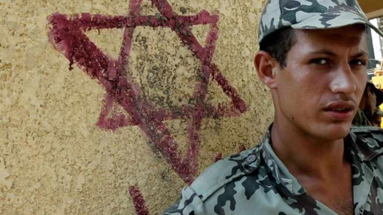 An Egyptian army soldier stands beside a star of David, on a wall surrounding the Israeli Embassy in Cairo An Egyptian army soldier stands beside a star of David, on a wall surrounding the Israeli Embassy in Cairo September 4, 2011. Egypt has walled off Israel's embassy in Cairo after tensions between the two countries sparked a series of angry protests that reached a climax last month when a demonstrator scaled the building and removed the Israeli flag. As work began on the wall a few days ago, many Egyptians gathered nearby to show their displeasure. Picture taken September 4, 2011. REUTERS/Mohamed Abd El-Ghan