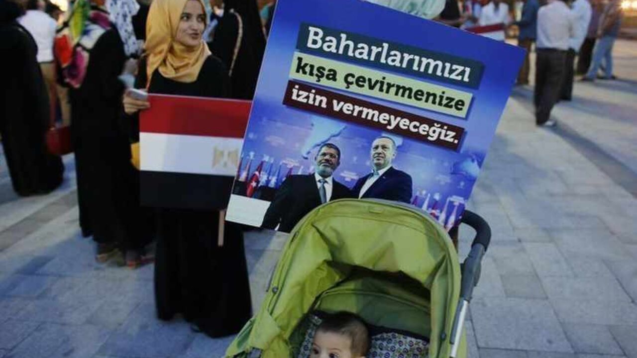 A poster with pictures of Egypt's President Mursi and Turkey's PM Erdogan is attached to a baby stroller during a pro-Islamist demonstration in Istanbul A poster with the pictures of Egypt's President Mohamed Mursi and Turkey's Prime Minister Tayyip Erdogan (R) is attached to a baby stroller during a pro-Islamist demonstration in Istanbul July 1, 2013. Pro-Islamist groups held a demonstration in Istanbul in support of Mursi on Tuesday. Egypt's armed forces handed Islamist President Mohamed Mursi a virtual ultimatum to share power on Monday, giving feuding politicians 48 hours to compromise or have the army impose its own road map for the country. The slogan