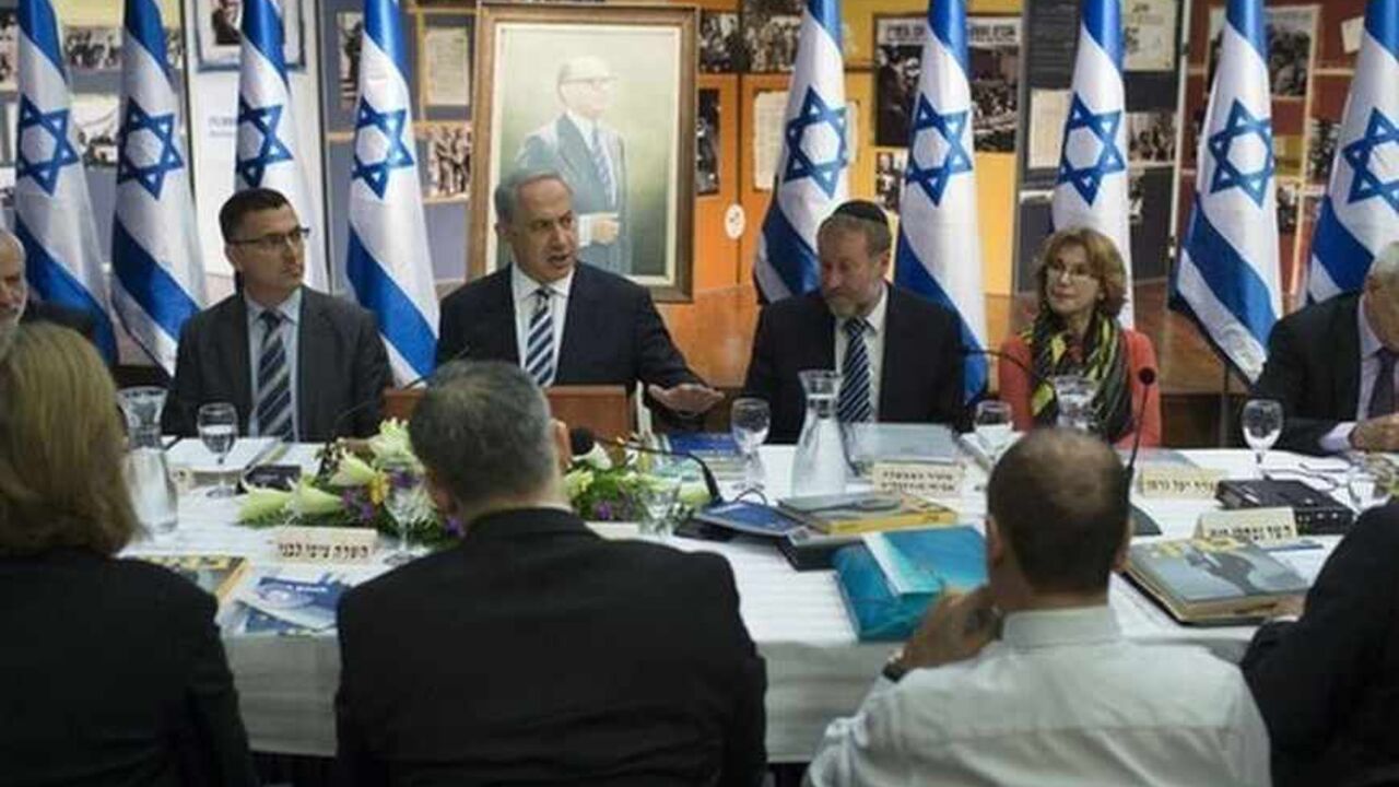 Israel's Prime Minister Netanyahu attends a special cabinet meeting in Jerusalem in commemoration of Menahem Begin Israel's Prime Minister Benjamin Netanyahu (3rd L) attends a special cabinet meeting in Jerusalem, in commemoration of the 100th anniversary of the birth of late Israeli Prime Minister Menahem Begin July 21, 2013. Netanyahu's tentative agreement to revive U.S.-sponsored peace talks with the Palestinians met scepticism and scorn on Sunday from some members of his rightist coalition government, including within his own party. Reuters/Uriel Sinai/Pool (JERUSALEM - Tags: POLITICS) - RTX11TPU
