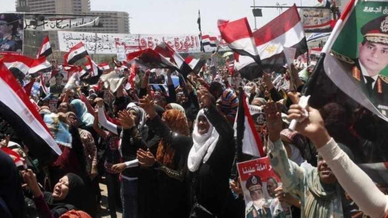 Anti-Mursi protesters carry posters of army chief Abdel-Fattah El-Sisi during mass protest in Tahrir square Anti-Mursi protesters carry posters of army chief Abdel-Fattah El-Sisi as they chant slogans during a mass protest to support the army in Tahrir square, Cairo, July 26, 2013. Many of those Egyptians opposed to ousted President Mohamed Mursi say their admiration for the army has never wavered, and that any anger was always directed at the generals in charge. In the turbulent world of Egyptian politics since Hosni Mubarak, a former air force marshal, was toppled, the military is seen as an institution that of