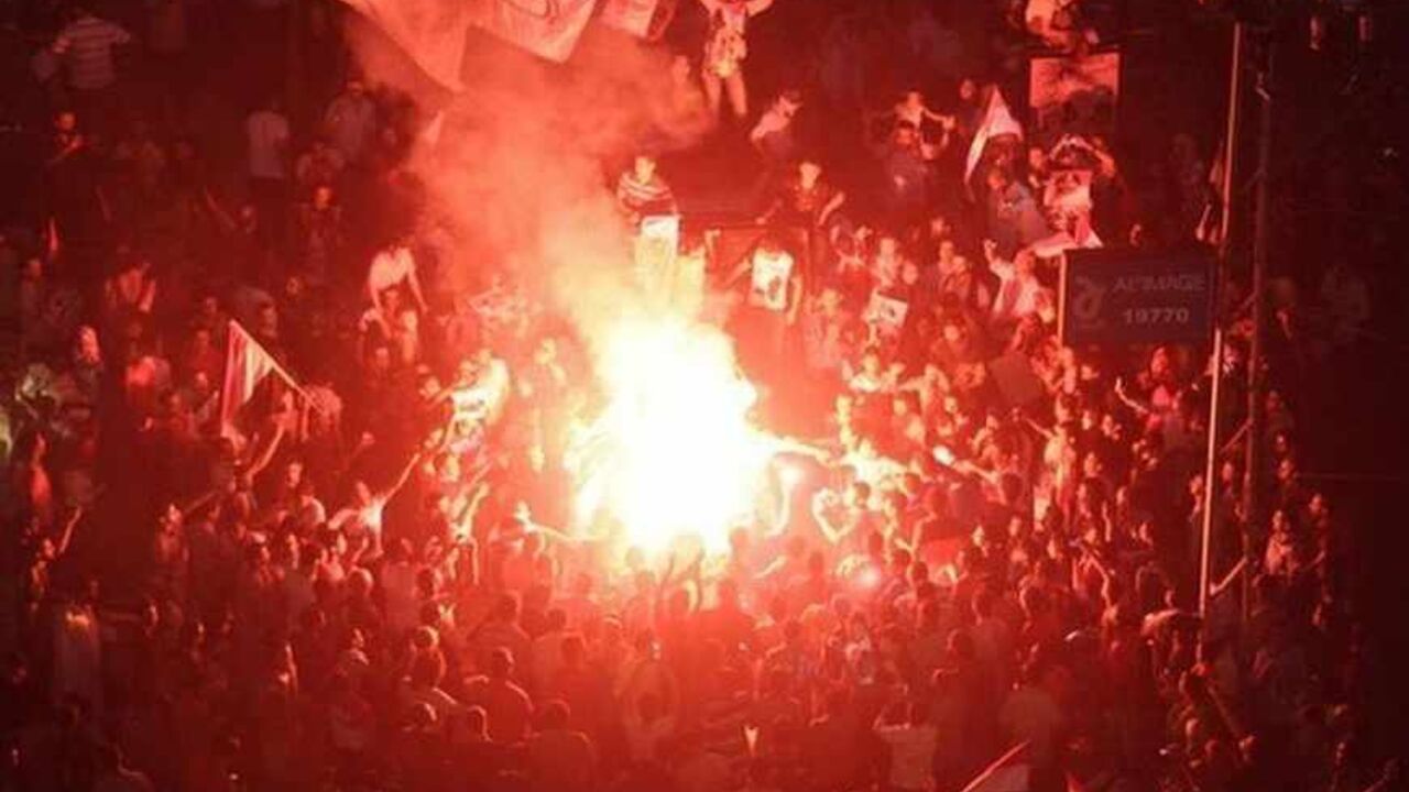 Protesters cheer and dance with flares as they gather for a mass protest to support the army in front of the presidential palace in Cairo Protesters cheer and dance with flares as they gather for a mass protest to support the army in front of the presidential palace in Cairo July 26, 2013. At least seven people were killed and hundreds wounded in scattered violence across Egypt during mass rallies for and against the army's overthrow of Islamist President Mohamed Mursi, who was placed under investigation for murder. REUTERS/Asmaa Waguih (EGYPT - Tags: POLITICS CIVIL UNREST) - RTX120O6