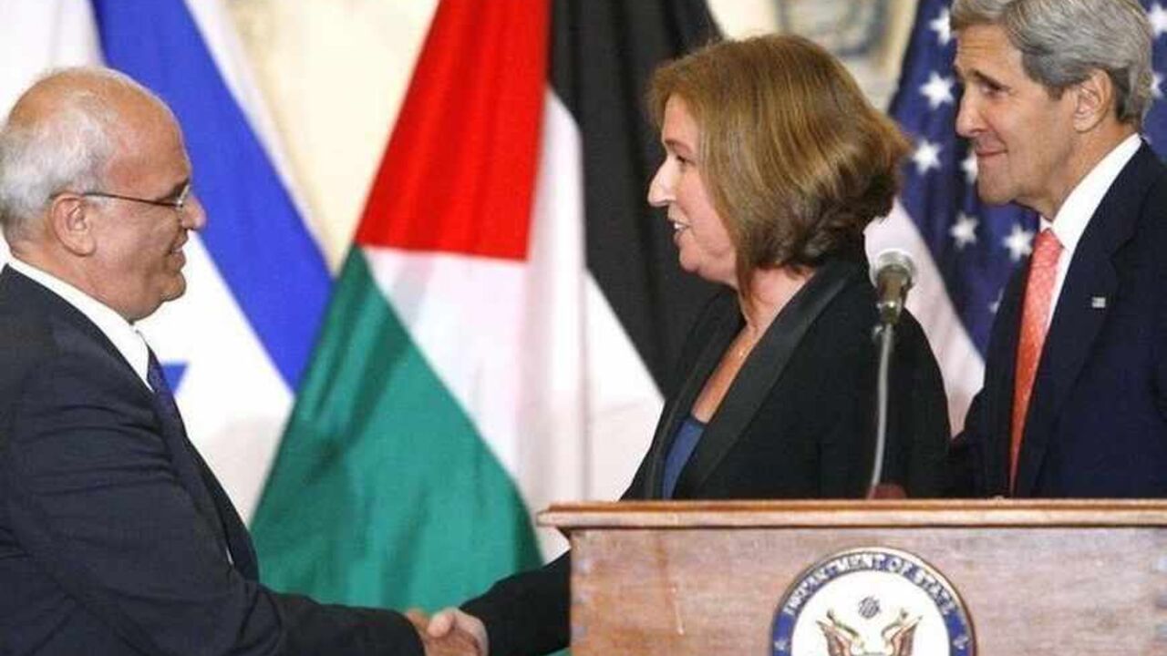 Chief Palestinian negotiator Saeb Erekat shakes hands with Israel's Justice Minister Tzipi Livni near U.S. Secretary of State John Kerry after announcing further talks at a news conference in Washington Chief Palestinian negotiator Saeb Erekat (L) shakes hands with Israel's Justice Minister Tzipi Livni near U.S. Secretary of State John Kerry after announcing further talks at a news conference at the State Department in Washington July 30, 2013. Israel and the Palestinians will seek to reach a peace agreement within nine months and negotiators will meet again within two weeks after holding a "positive" first round of talks, Kerry said on Tuesday. REUTERS/Jonathan Ernst (UNITED STATES - Tags: POLITICS) - RTX