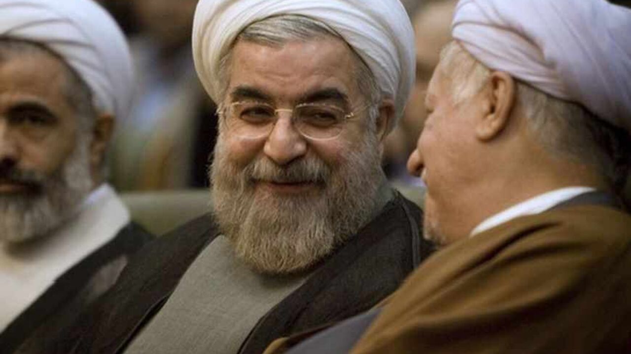 Iran's former chief nuclear negotiator, Hassan Rohani, attends a conference in Tehran Iran's former chief nuclear negotiator, Hassan Rohani (C), attends a conference called National Unity, Policies and Methods in Tehran November 12, 2007. REUTERS/Caren Firouz (IRAN) - RTX8ZM
