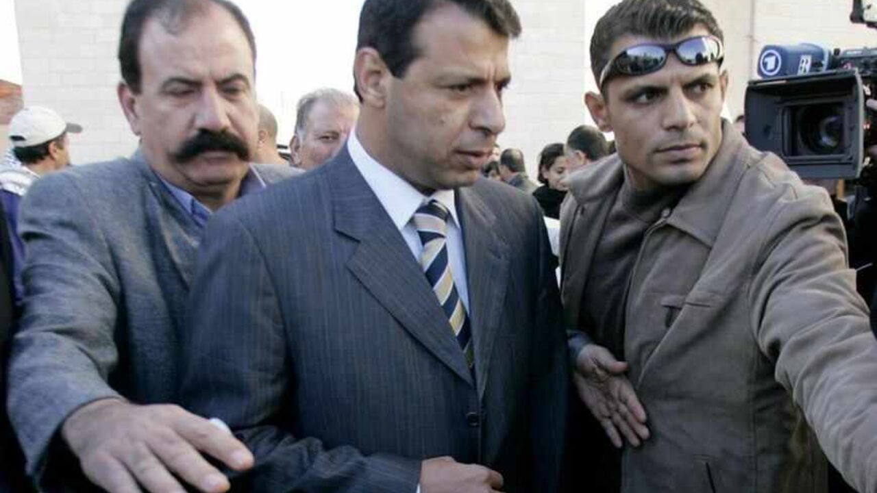 Fatah strongman and lawmaker Mohammed Dahlan arrives at the Palestinian Authority headquarters in the West Bank city of Ramallah Fatah strongman and lawmaker Mohammed Dahlan (C) arrives at the Palestinian Authority headquarters in the West Bank city of Ramallah December 16, 2006. Hamas spokesman Ismail Rudwan accused Fatah strongman and lawmaker Mohammed Dahlan of being behind the attack on Prime Minister Ismail Haniyeh's convoy. REUTERS/Loay Abu Haykel (WEST BANK) - RTR1KH1X