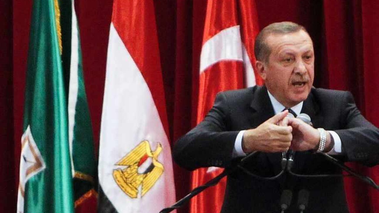 Turkish Prime Minister Tayyip Erdogan delivers a speech at Cairo University Turkish Prime Minister Tayyip Erdogan delivers a speech at Cairo University after his meeting with the Egyptian President Mohamed Mursi during the first day of his two-day trip to Egypt, November 17, 2012. Erdogan, an outspoken of critic of Israel, praised Egypt's Islamist president Mursi on Saturday for recalling his ambassador from Tel Aviv in response to Israeli attacks on Gaza. REUTERS/Asmaa Waguih (EGYPT - Tags: POLITICS TPX IMAGES OF THE DAY) - RTR3AJ7X