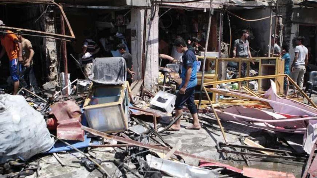 Residents inspect the site of a car bomb attack in Basra, southeast of Baghdad Residents inspect the site of a car bomb attack in Basra, 420 km (260 miles) southeast of Baghdad, July 29, 2013. One car bomb went off in a busy popular market north of the southern oil hub city of Basra on Monday, killing at least two civilians and wounding 10 others, police and medical sources said. REUTERS/Stringer (IRAQ - Tags: CIVIL UNREST) - RTX123II