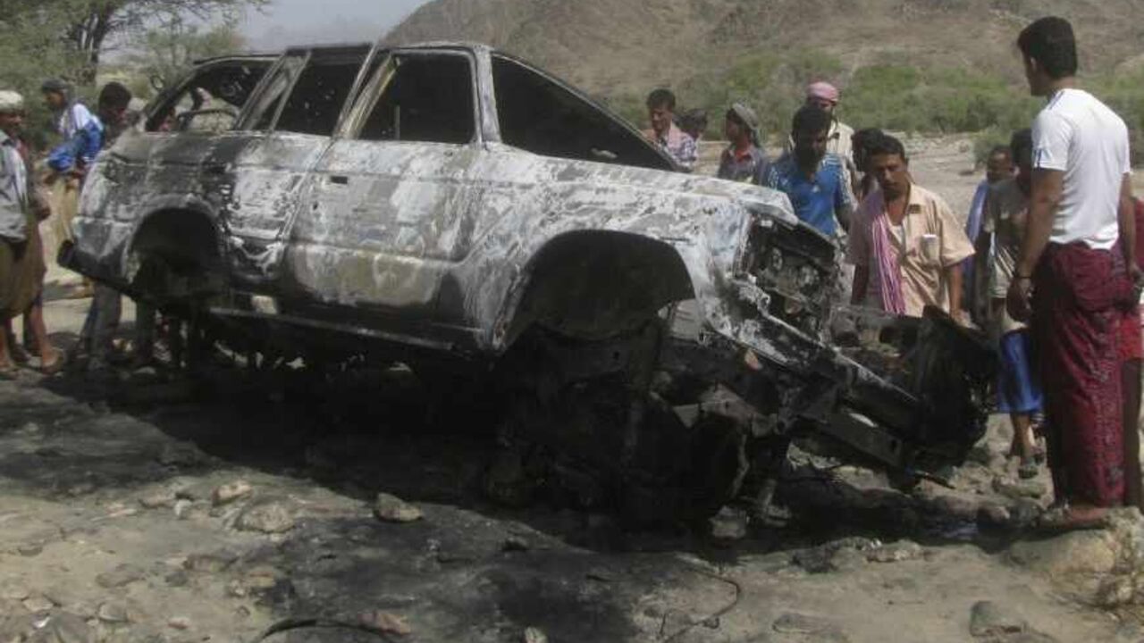 People gather at the site of a drone strike on the road between Yafe and Radfan districts of the southern Yemeni province of Lahj People gather at the site of a drone strike on the road between Yafe and Radfan districts of the southern Yemeni province of Lahj August 11, 2013. Local officials and residents in Yemen's southern Lahj Province said a drone destroyed a vehicle travelling on a mountain road late on Saturday evening killing its two occupants and bringing to 15 the death toll from four strikes in three days. REUTERS/Stringer (YEMEN - Tags: POLITICS CIVIL UNREST) - RTX12H45