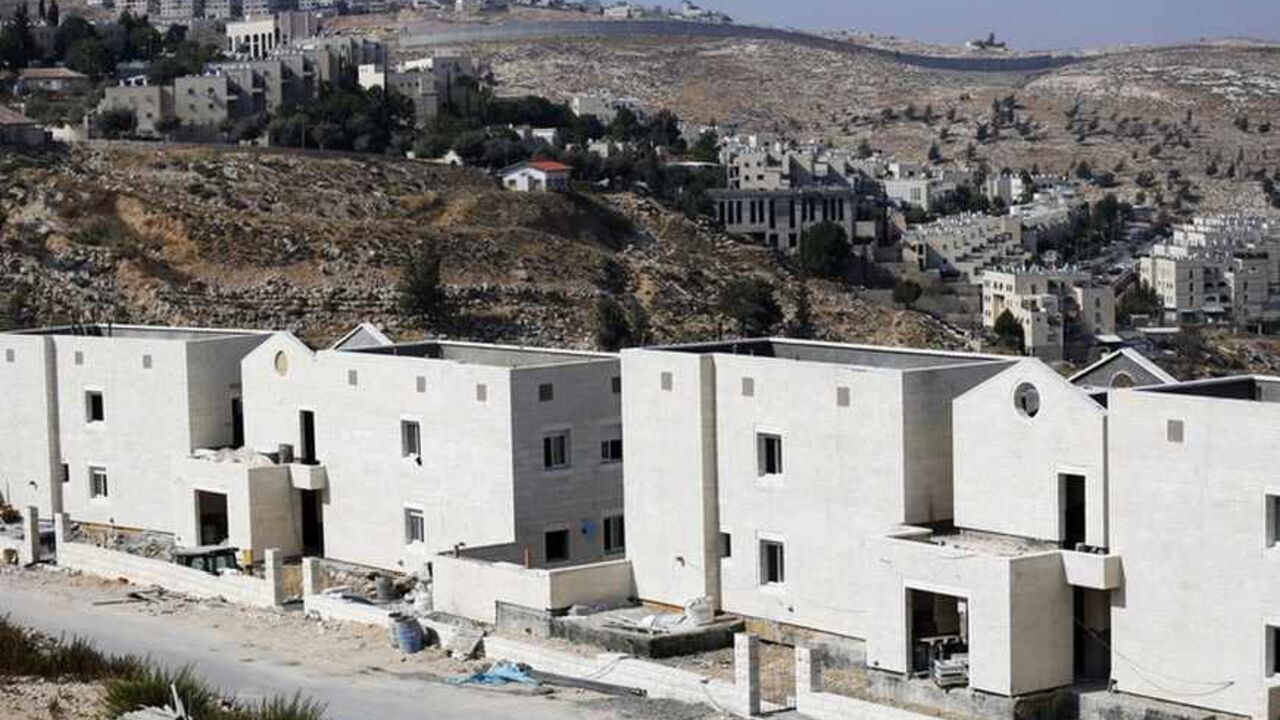Apartment blocks under construction are seen in Pisgat Zeev, an urban settlement in an area Israel annexed to Jerusalem after capturing it in the 1967 Middle East war Apartment blocks under construction (front) are seen in Pisgat Zeev, an urban settlement in an area Israel annexed to Jerusalem after capturing it in the 1967 Middle East war, August 12, 2013. Israel on Monday named 26 Palestinian prisoners to be freed this week under a deal enabling U.S.-backed peace talks to resume, although Palestinians said these had been undermined by newly announced plans to expand Israeli settlements. REUTERS/Amir Cohen (JERUSALEM - Tags: POLITICS BUSINESS CONSTRUCTION) - RTX12IKF