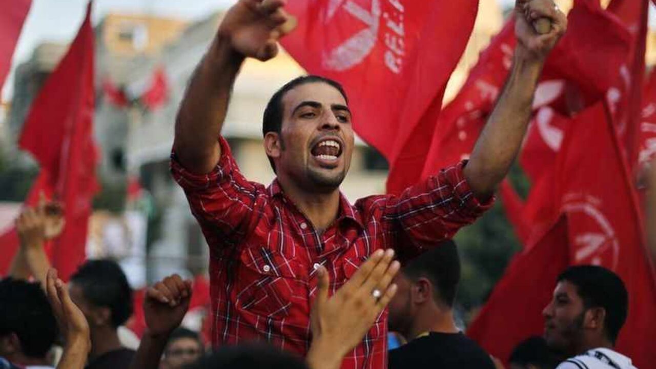 A man shouts slogans during a rally marking the anniversary of the killing of leader of the PFLP in Gaza A Palestinian shouts slogans during a rally marking the 12th anniversary of the killing of Abu Ali Mustafa, leader of the Popular Front for the Liberation of Palestine (PFLP), in Gaza City August 27, 2013. Abu Mustafa was killed in an Israeli missile attack in Ramallah in 2001. REUTERS/Suhaib Salem (GAZA - Tags: POLITICS CIVIL UNREST ANNIVERSARY) - RTX12Y2J