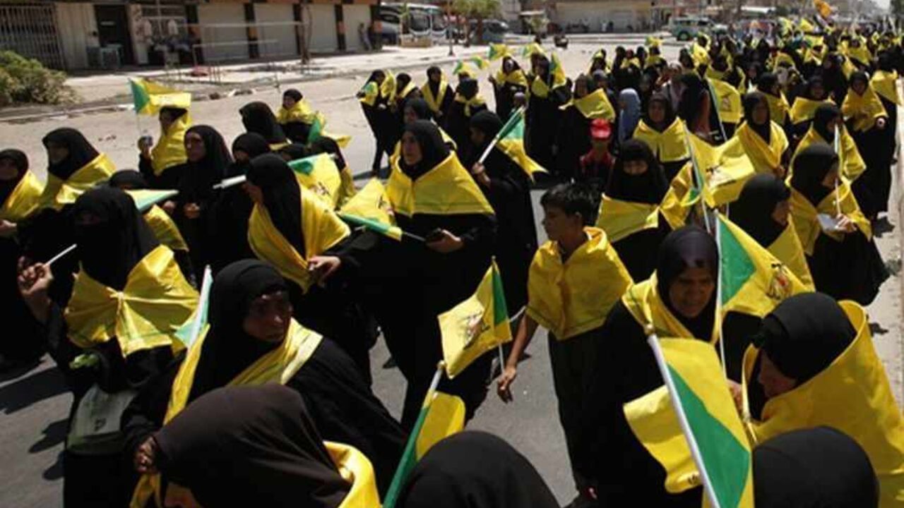 IRAQ/ Women march during a rally to mark "Al Quds" or Jerusalem Day in Baghdad, August 2, 2013. REUTERS/Saad Shalash(IRAQ - Tags: CIVIL UNREST) - RTX12859