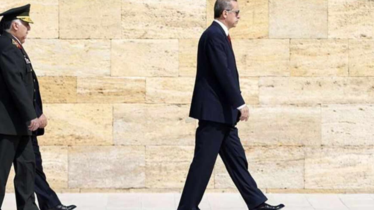 TURKEY/ Turkey's Prime Minister Tayyip Erdogan (R) attends a wreath-laying ceremony as he is followed by Chief of Staff General Necdet Ozel at the mausoleum of Mustafa Kemal Ataturk, founder of modern Turkey, in Ankara August 1, 2013. REUTERS/Umit Bektas (TURKEY - Tags: MILITARY POLITICS) - RTX126OB
