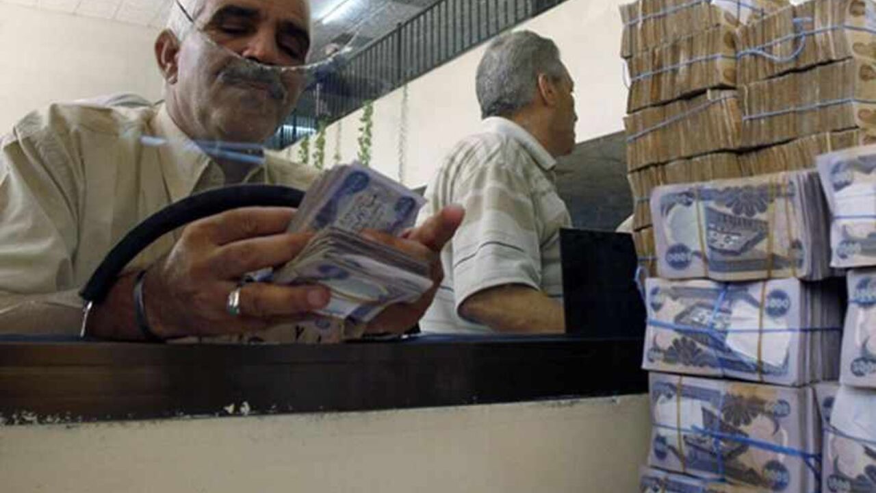 IRAQ/BANKS A client counts his money at Al-Rafidain bank in BaghdadJune 21, 2009. Total bank deposits in February -- the latest figures available -- jumped by half to 36.6 trillion Iraqi dinars ($31 billion) from a year before, and loans surged 65 percent to 5.1 trillion dinars over the same period, central bank data show.
To match feature IRAQ/BANKS REUTERS/Bassim Shati (IRAQ CONFLICT BUSINESS) - RTR2559B