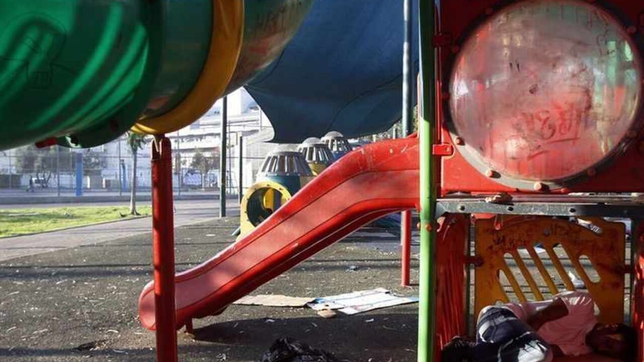 African migrant sleeps in a playground in South Tel Aviv An African migrant sleeps in a playground at Levinsky park in South Tel Aviv June 12, 2012. About 60,000 Africans have crossed into Israel across its porous border with Egypt in recent years. Israel says the vast majority are job seekers, disputing arguments by humanitarian agencies that they should be considered for asylum. Picture taken June 12, 2012. REUTERS/Baz Ratner (ISRAEL - Tags: SOCIETY IMMIGRATION) - RTR33VHH