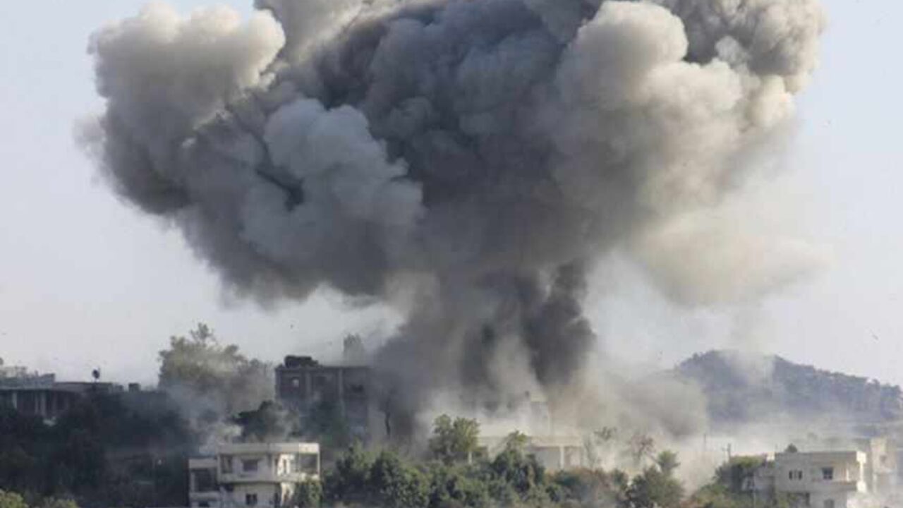 SYRIA-CRISIS/ Smoke rises after what activists said was shelling by forces loyal to Syria's President Bashar al-Assad in the village of Dourit, in Latakia countryside August 17, 2013. Picture taken August 17, 2013. REUTERS/Khattab Abdulaa (SYRIA - Tags: POLITICS CIVIL UNREST TPX IMAGES OF THE DAY) - RTX12PMS