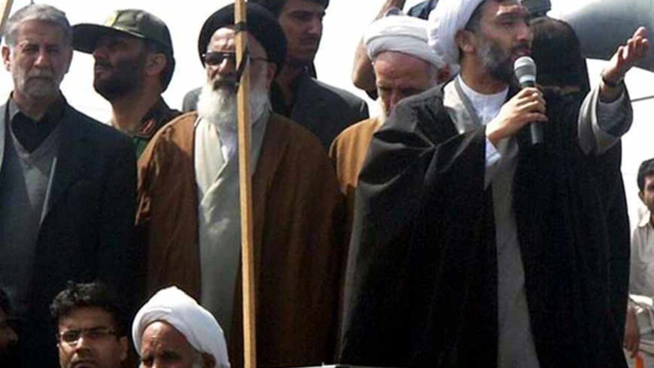 IRAN Iran's Interior Minister Mostafa Pour-Mohammadi (R) speaks during a funeral ceremony for victims who were killed in an attack by bandits in Zabol, 1,605 km (997 miles) south of Tehran March 18, 2006. REUTERS/IRNA - RTR17CL9