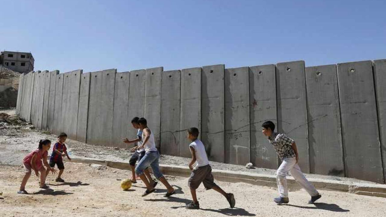 Palestinian children play near the controversial Israeli barrier in Shuafat refugee camp in the West Bank near Jerusalem Palestinian children play near a section of the controversial Israeli barrier in Shuafat refugee camp in the West Bank near Jerusalem July 29, 2013. Israeli and Palestinian officials put forward clashing formats for peace talks due to resume in Washington on Monday for the first time in nearly three years after intense U.S. mediation. It is unclear how the United States hopes to bridge the core issues in the dispute, including borders, the future of Jewish settlements on the West Bank, the fate of Palestini