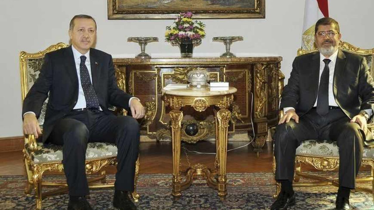 Egyptian President Mursi meets with Turkish PM Erdogan at the Presidential Palace in Cairo Egyptian President Mohamed Mursi (R) meets with Turkish Prime Minister Tayyip Erdogan at the Presidential Palace in Cairo November 17, 2012. REUTERS/Egyptian Presidency/Handout (EGYPT - Tags: POLITICS) FOR EDITORIAL USE ONLY. NOT FOR SALE FOR MARKETING OR ADVERTISING CAMPAIGNS. THIS IMAGE HAS BEEN SUPPLIED BY A THIRD PARTY. IT IS DISTRIBUTED, EXACTLY AS RECEIVED BY REUTERS, AS A SERVICE TO CLIENTS - RTR3AINS