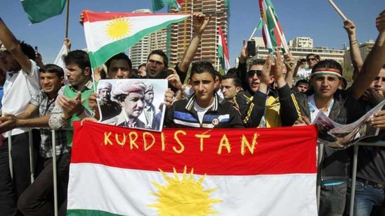 Men hold Kurdish flags and a poster of Kurdistan leader Masoud Barazani during a Nowruz celebration organized by Kurdish groups at the seaside town of Rawshe in Beirut Men hold Kurdish flags and a poster of Kurdistan leader Masoud Barazani during a Nowruz celebration organized by Kurdish groups at the seaside town of Rawshe in Beirut, March 21, 2013. REUTERS/Sharif Karim (LEBANON - Tags: RELIGION POLITICS) - RTR3FA2H