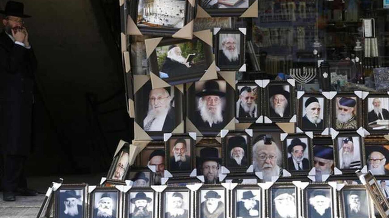 An ultra-Orthodox Jewish man stands near a display of pictures of Rabbis and religious leaders for sale outside a shop in Jerusalem's Mea Shearim neighbourhood An ultra-Orthodox Jewish man stands near a display of pictures of Rabbis and religious leaders for sale outside a shop in Jerusalem's Mea Shearim neighbourhood June 4, 2013. Often living in de-facto ghettos of their own making, the majority of Haredi men are allowed to shun the army and dedicate their life to religious study, living off donations, state benefits and the often meagre wages of wives. In a country where most 18-year-old Jewish men and women are conscripted such treatment is causing growing res